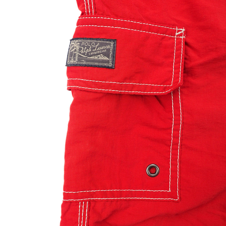 Close-up of a red pocket with a Ralph Lauren label on a white background