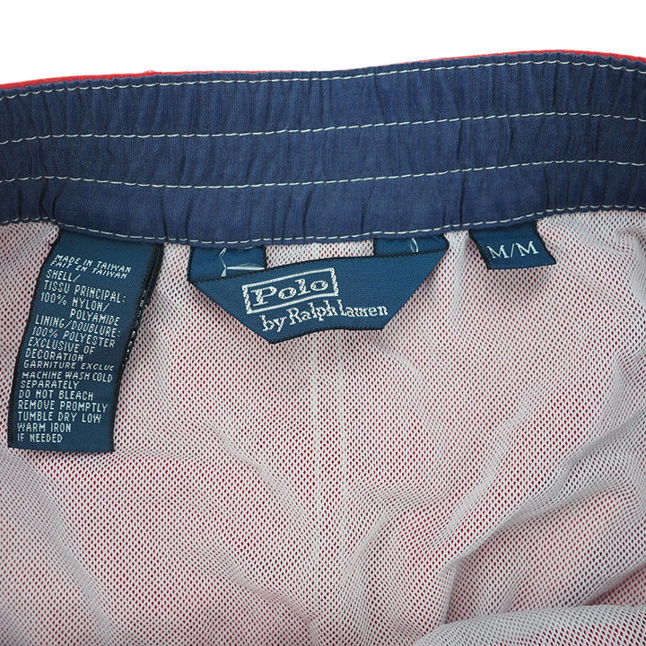 Close-up of Polo Ralph Lauren clothing with label details on a white background