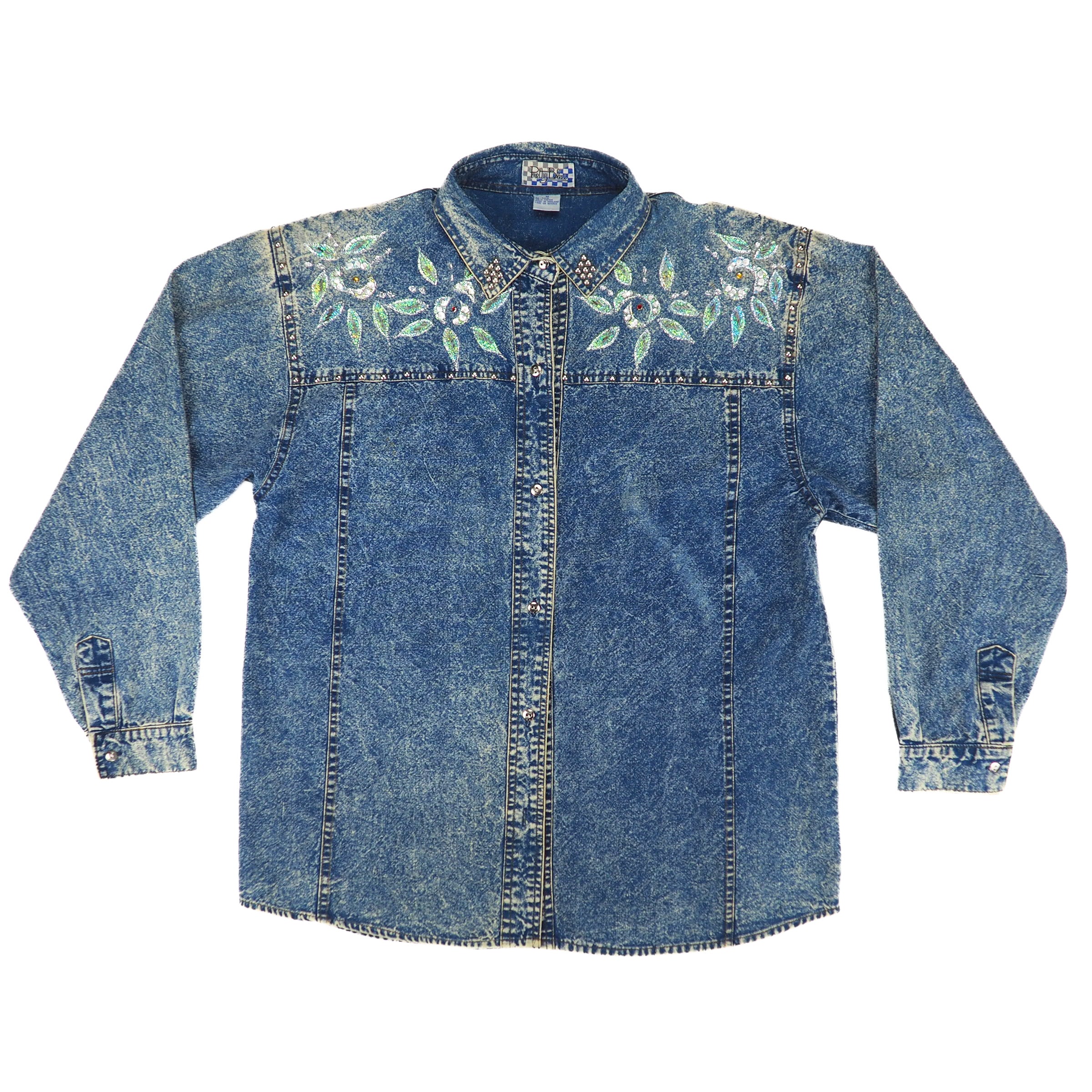 Front view of a 90s western style acid wash blue denim shirt with floral embroidery on a white background.