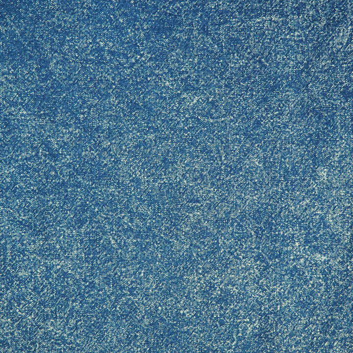 Close-up detail focusing on the texture of a vintage washed blue denim fabric.