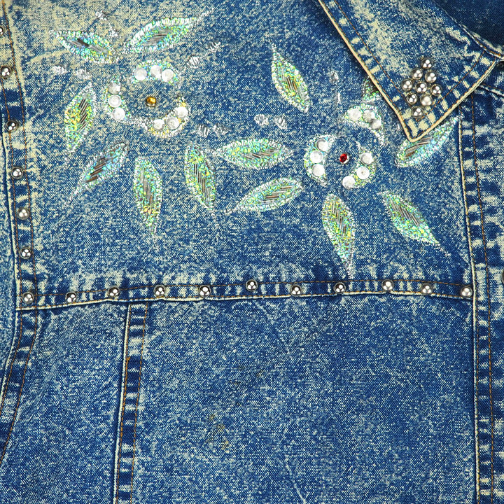 Blue denim shirt chest detail with floral embellishments and rhinestones