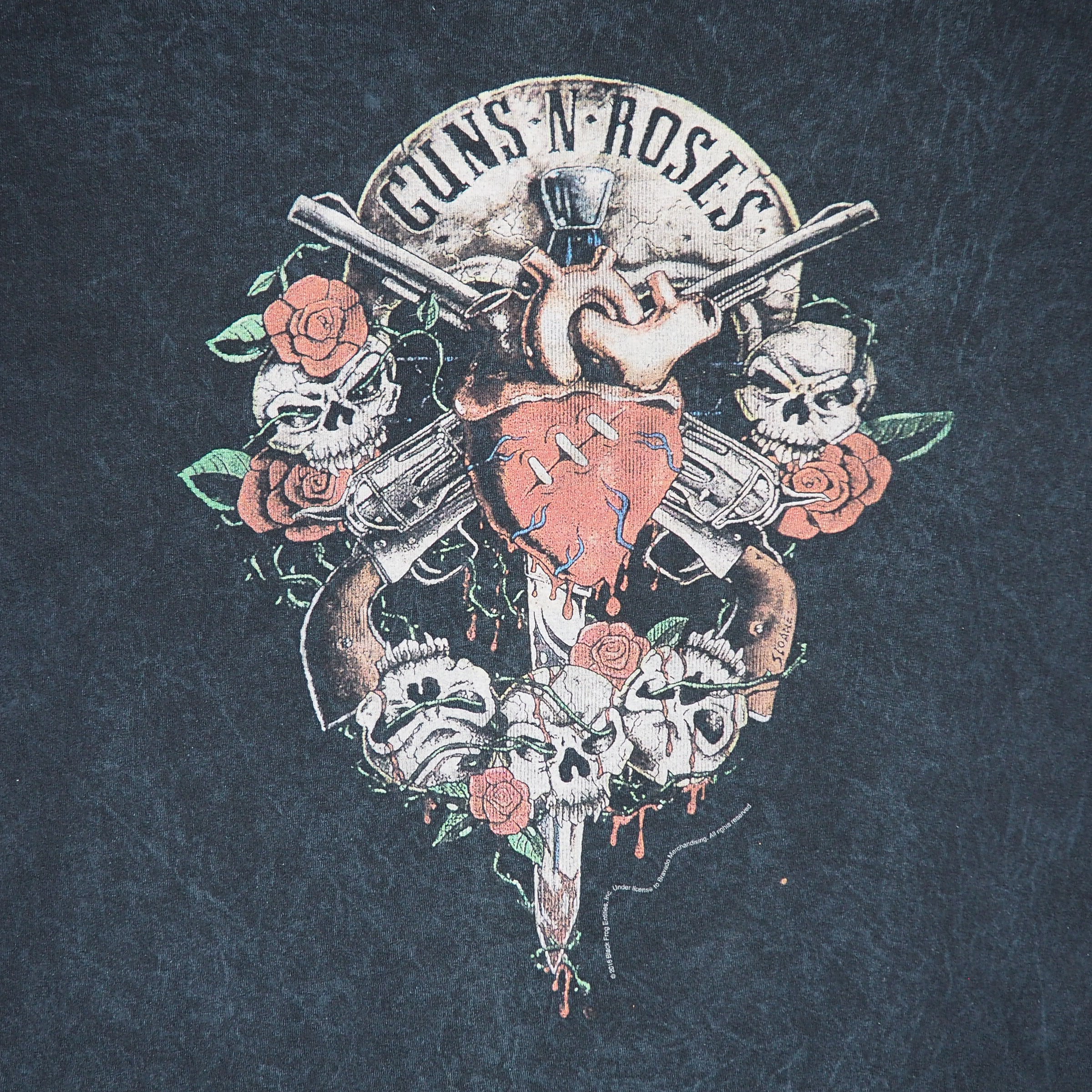 Detail of a 'Guns N Roses' graphic logo on a black t-shirt