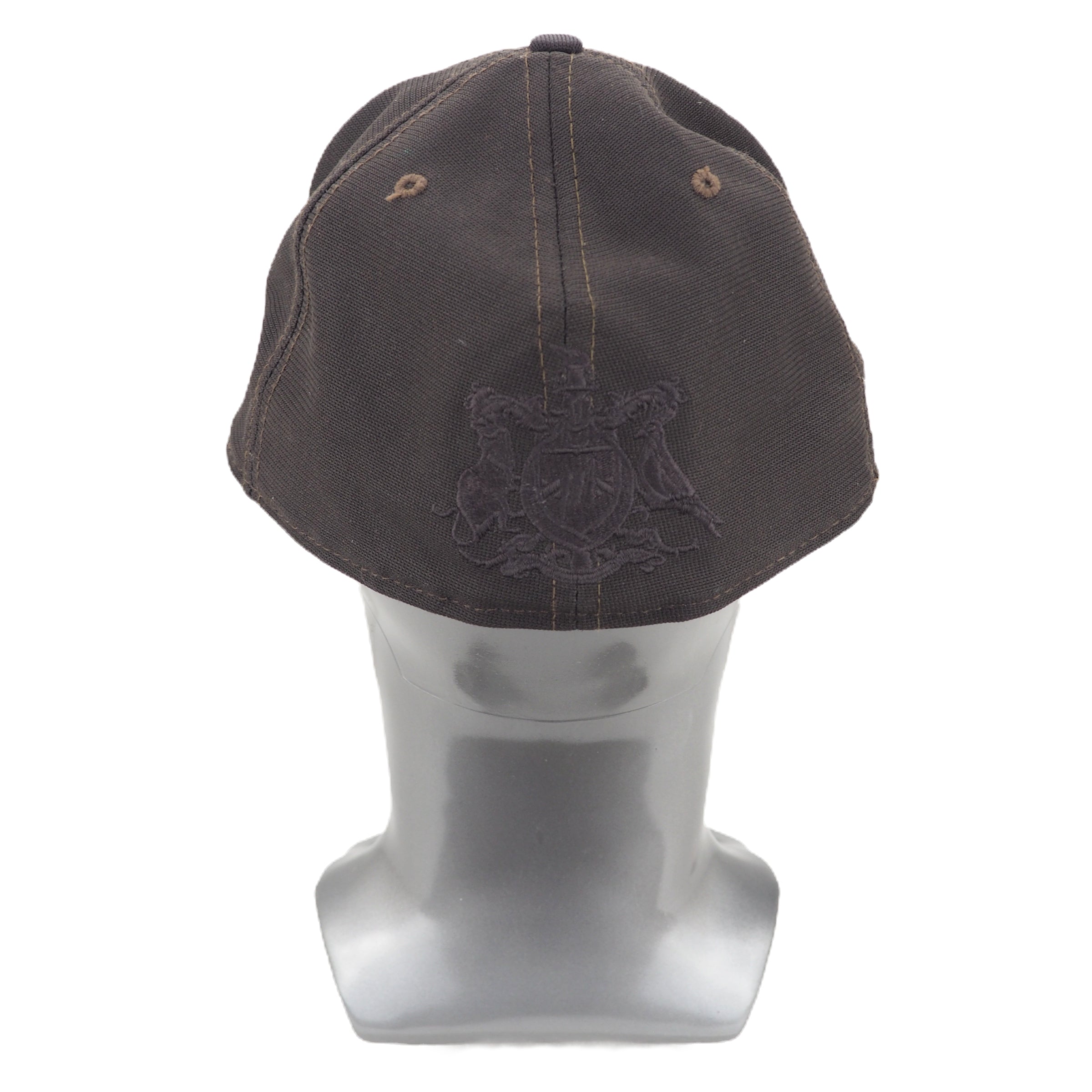 Dark brown cap with a logo on a mannequin head against a white background