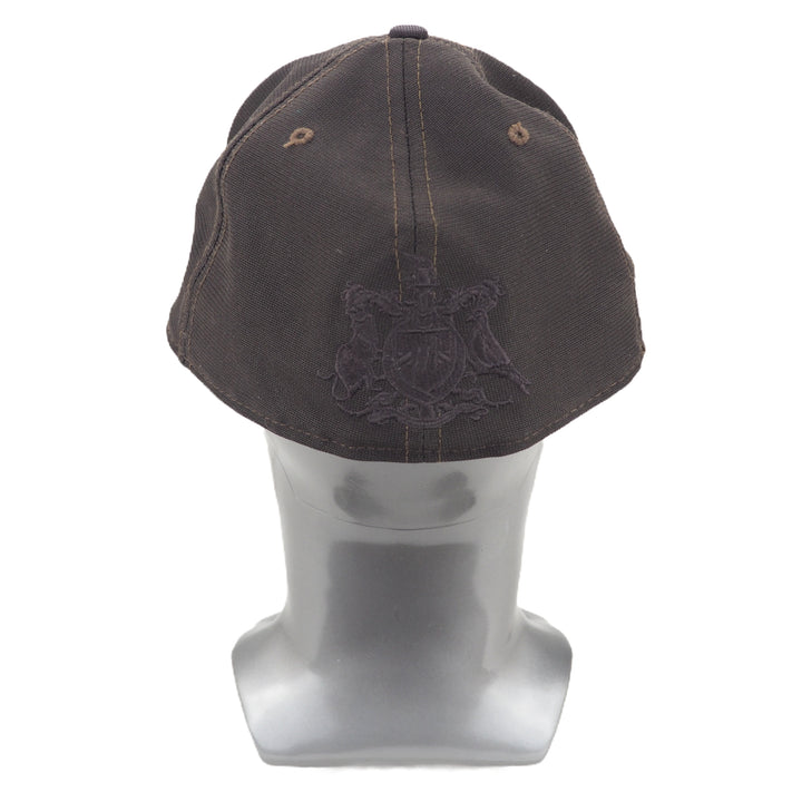 Dark brown cap with a logo on a mannequin head against a white background