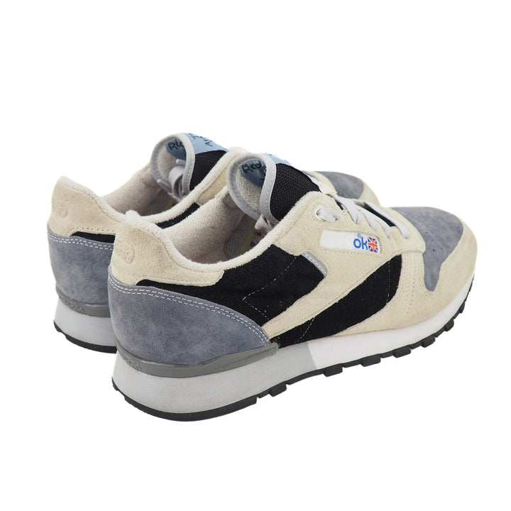 Pair of sneakers with a visible brand logo on a white background