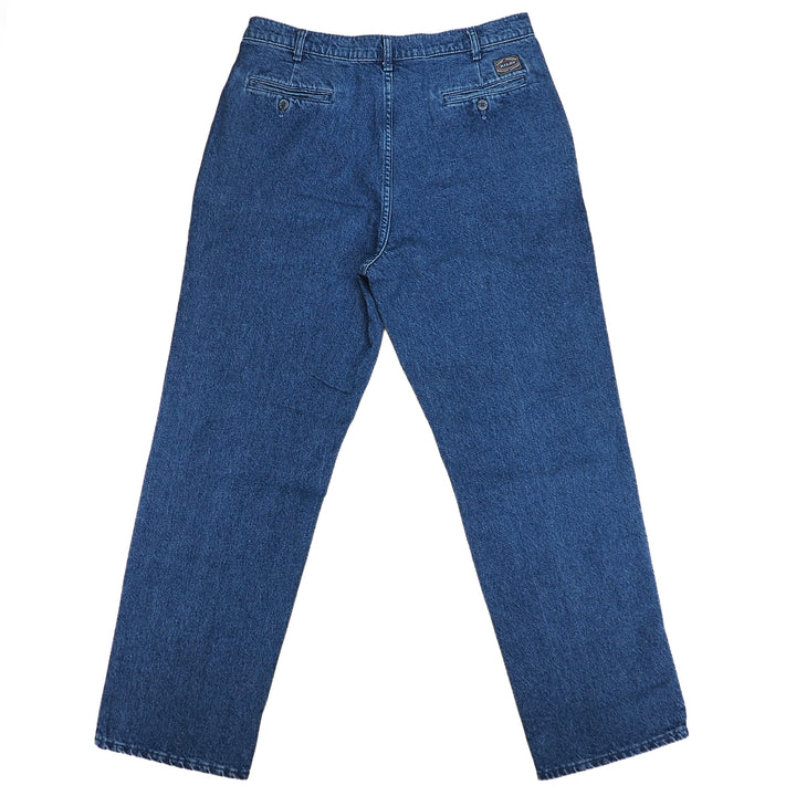 Rear view of a pair of blue denim jeans on a white background