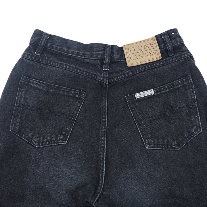 Back view of black jeans with Stone Canyon label on a white background