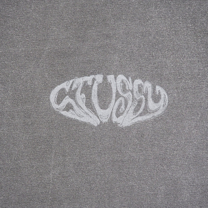 A close-up of a gray heathered fabric with a stylized white 'Stussy' logo printed across the center.