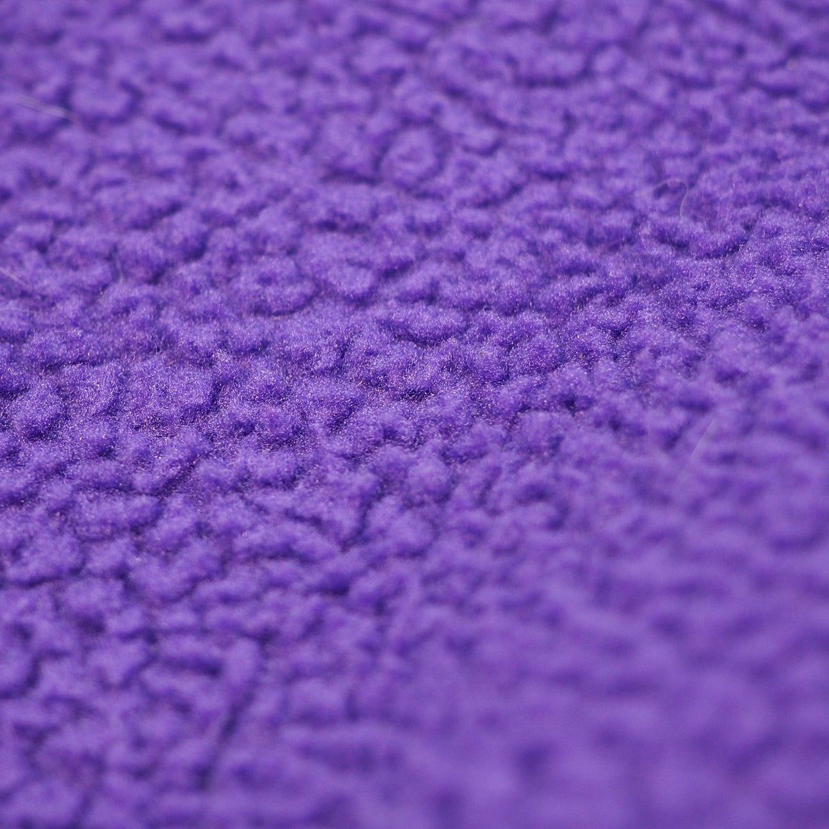 Close up of purple fleece fabric.