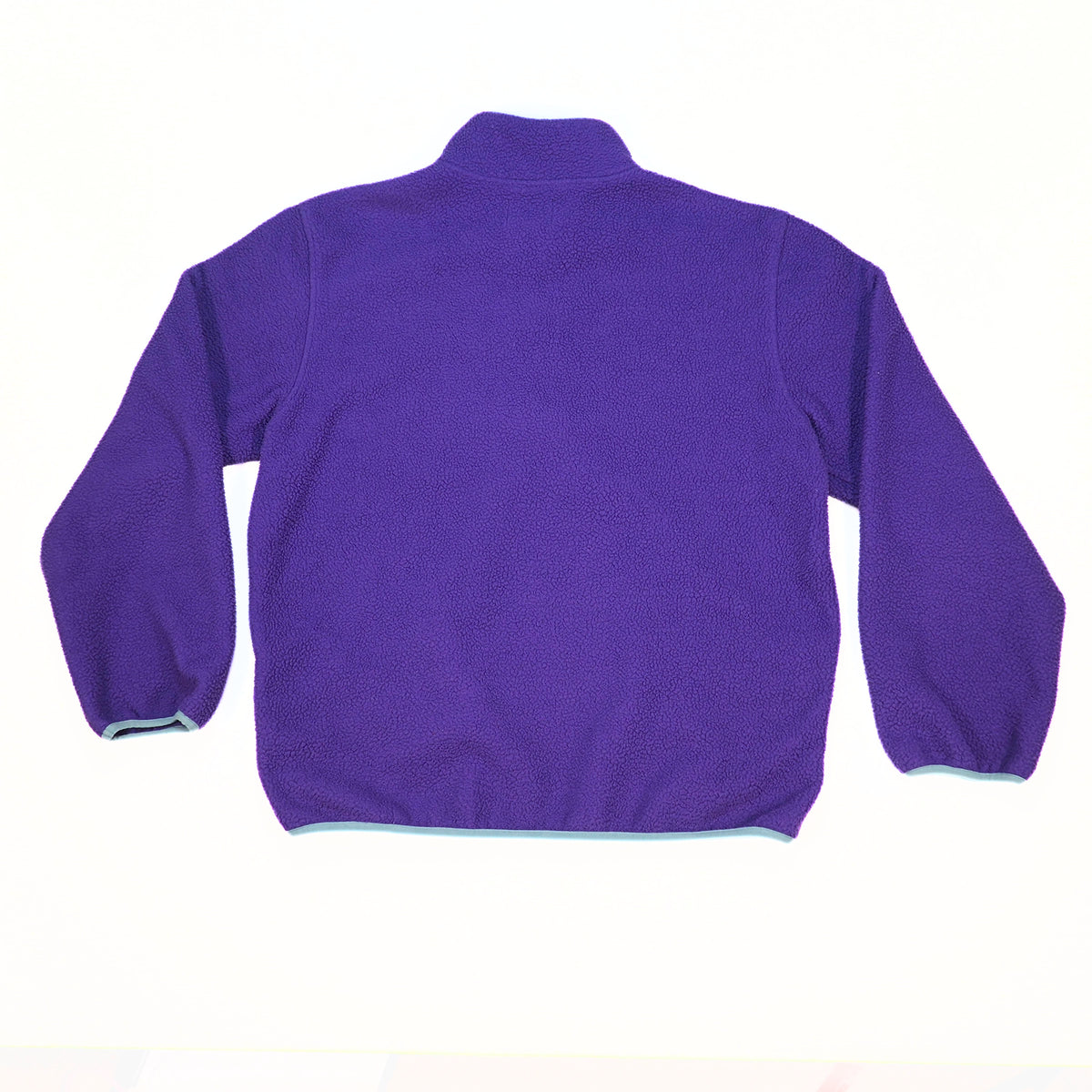 A purple fleece half-zip jacket shown from the back, laid flat on a white background.