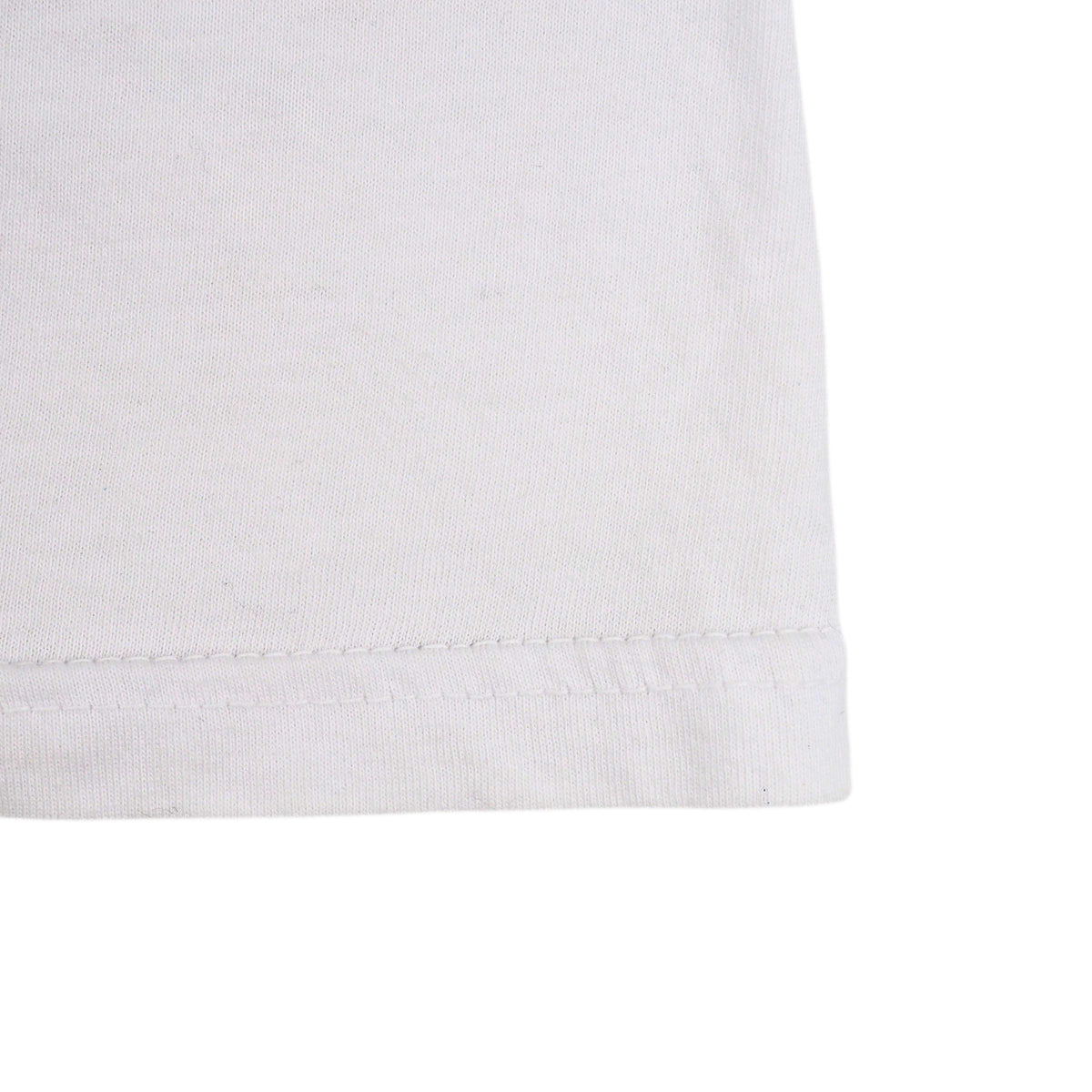 Close-up of a white cotton fabric cuff with a neat hemstitch, shown against a plain white background.