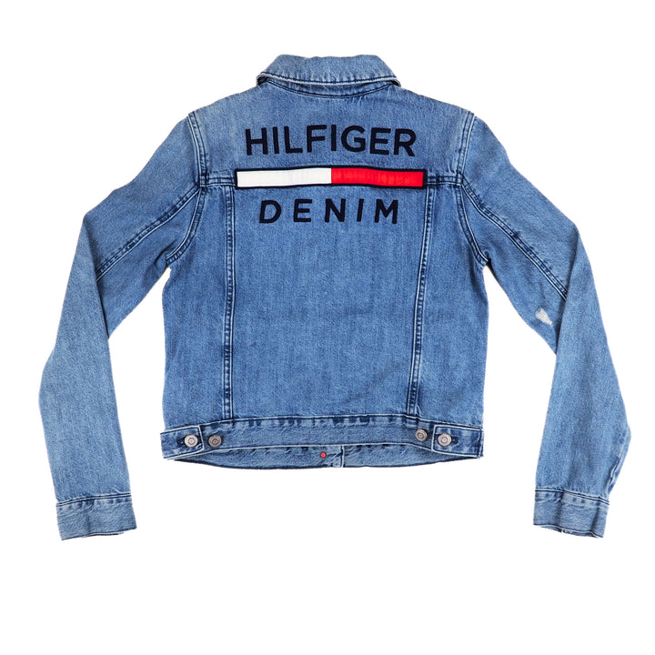 Back view of a light blue denim jacket with embroidered 'Tommy Hilfiger Denim' branding on a white background