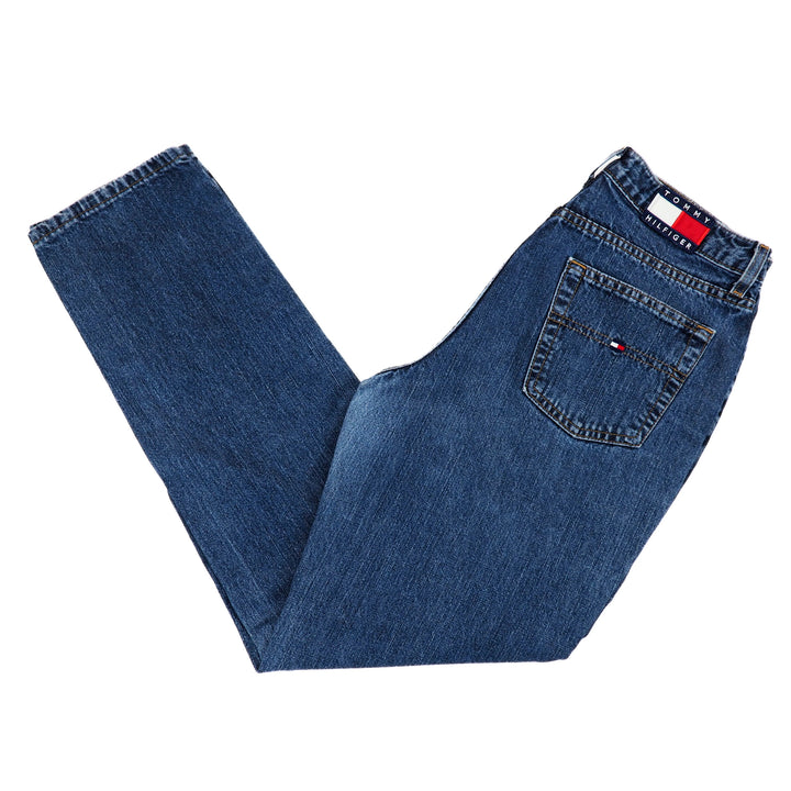Folded blue jeans with a brand logo on a white background