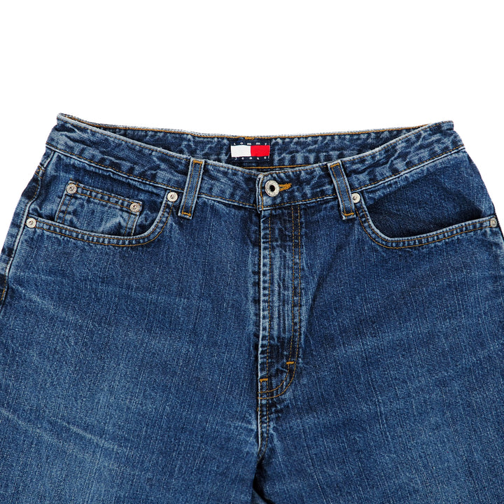 Close-up of blue jeans on a white background