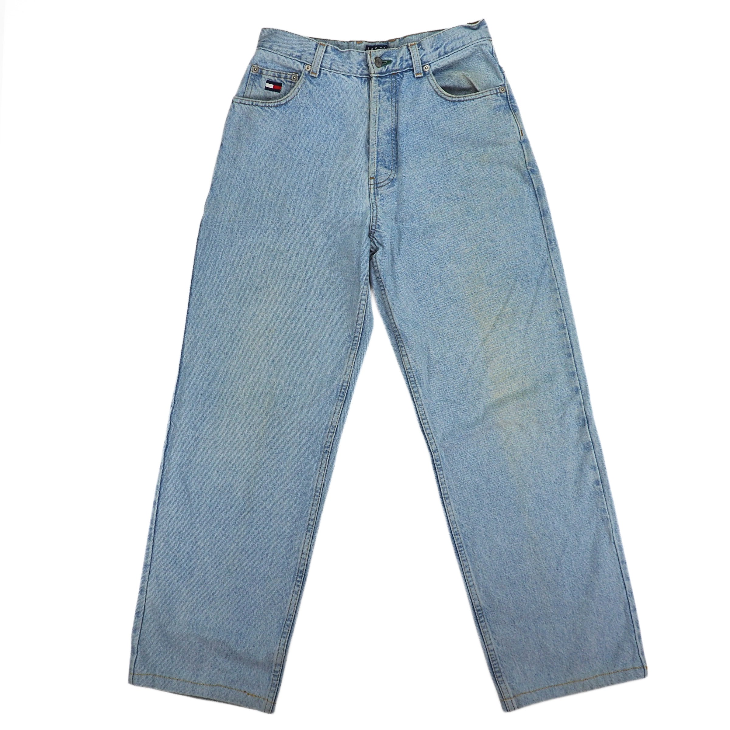 Light blue jeans with a Tommy Hilfiger flag  logo on a white background