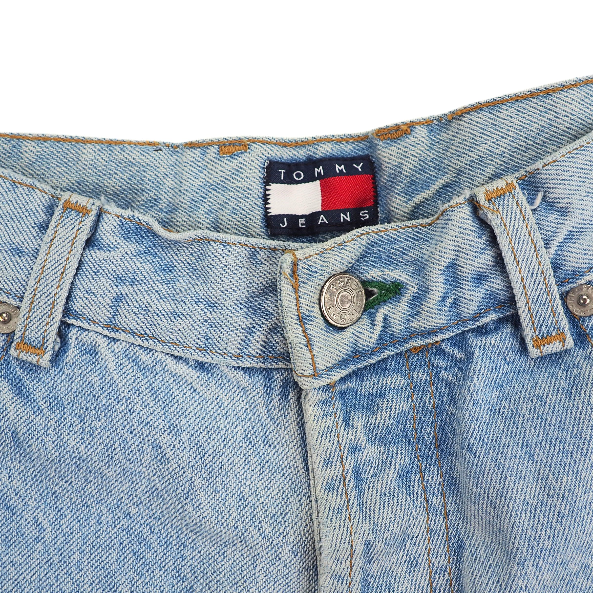 Close-up of a Tommy Jeans label on inside waistband of a pair of light blue denim jeans