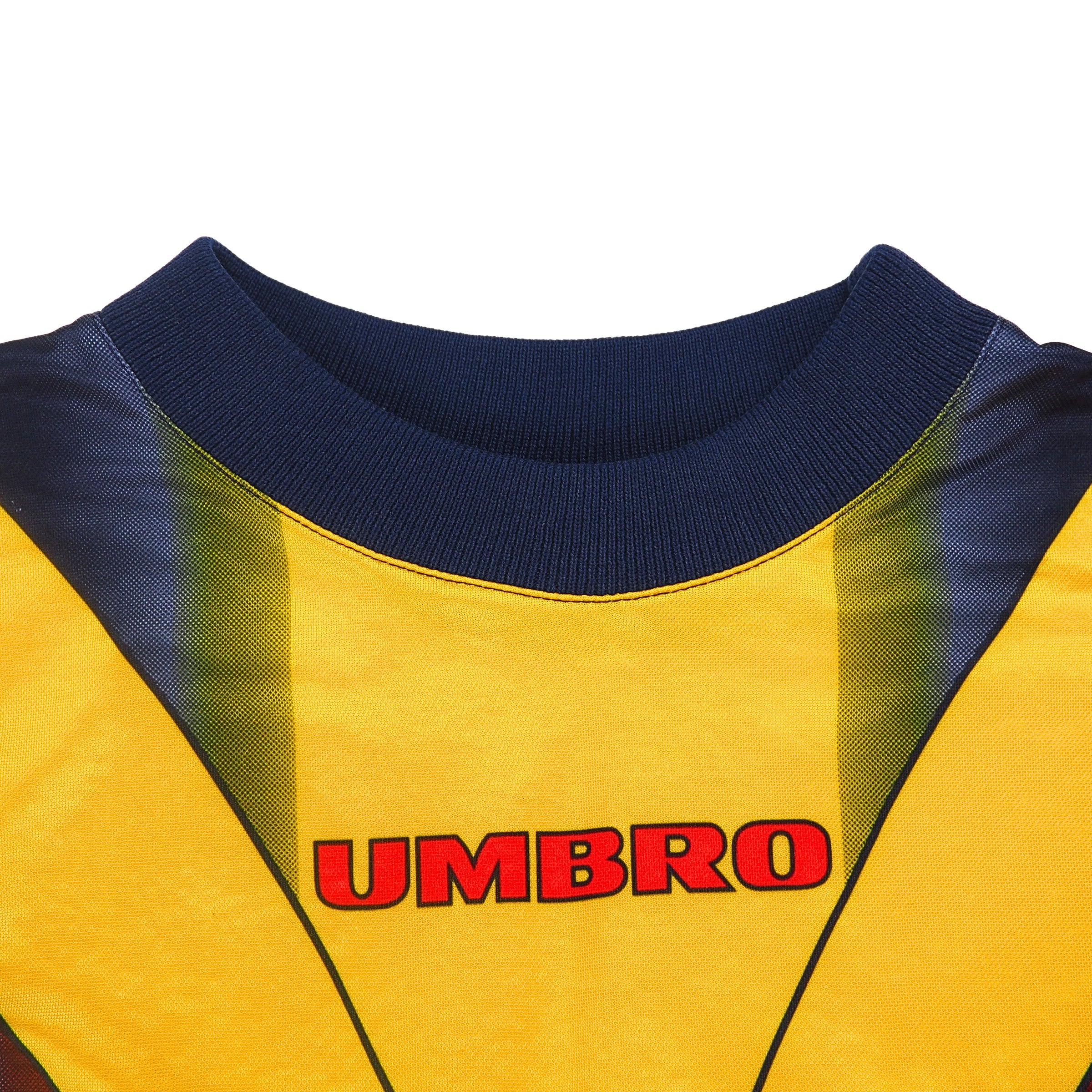Detail of the collar of an umbro soccer goalie jersey with colourful geometric pattern
