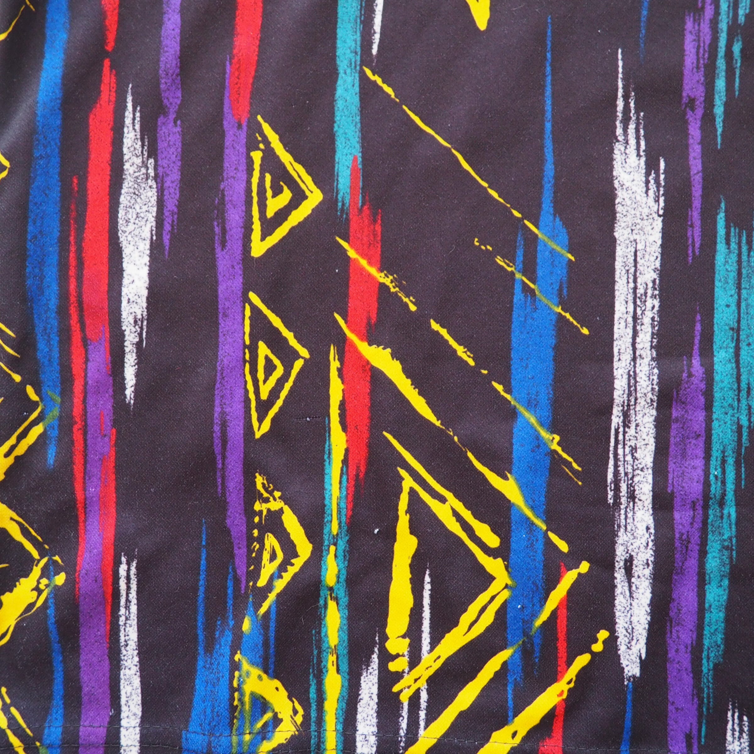 Colorful abstract pattern with triangles and vertical stripes on a black background