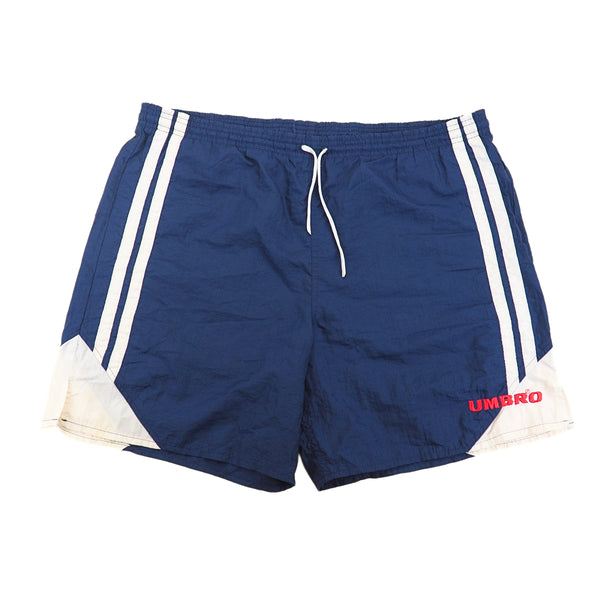 Blue shorts with white stripes and red 'Umbro' logo on a white background