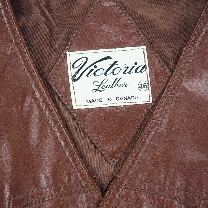 Close up of the inner tag on a leather waistcoat reading 'Victoria Leather Made in Canada'