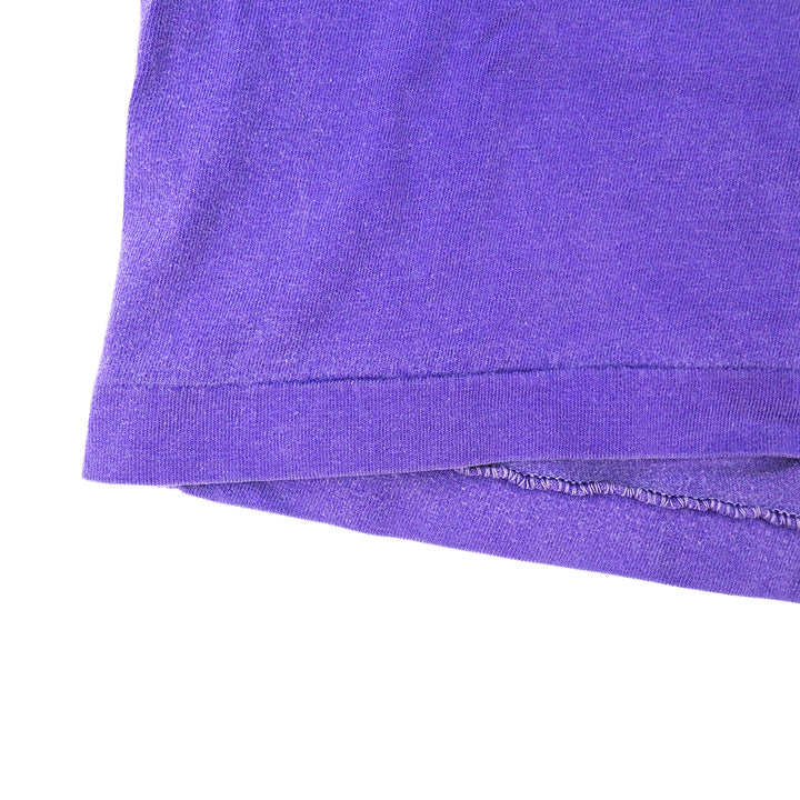 Close-up of a purple fabric edge on a white background