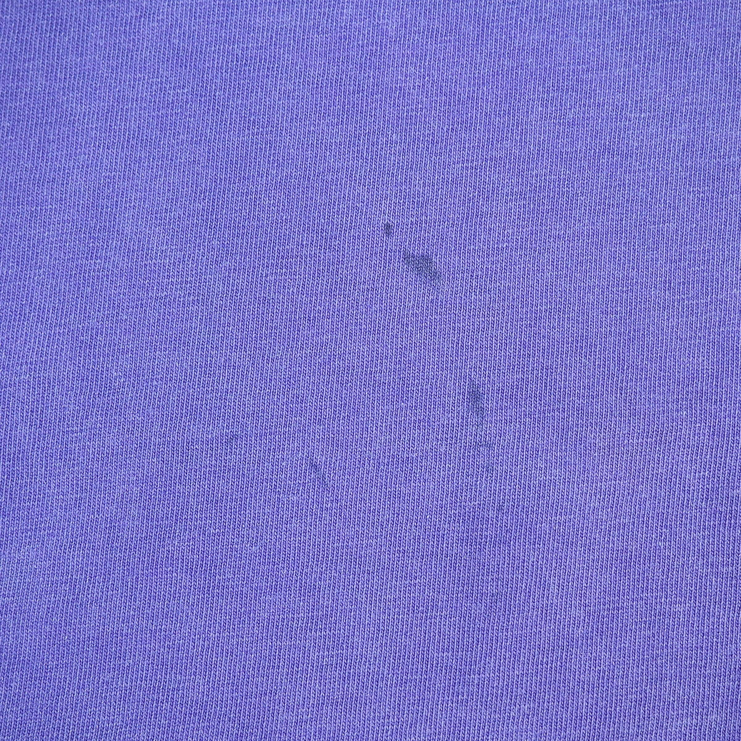 Close-up of a textured purple fabric surface