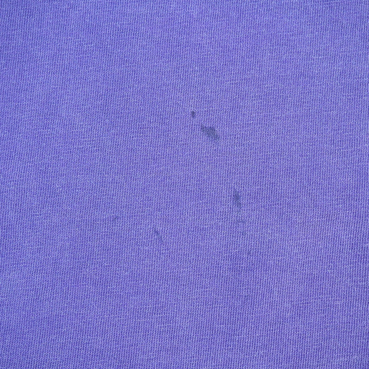 Close-up of a textured purple fabric surface