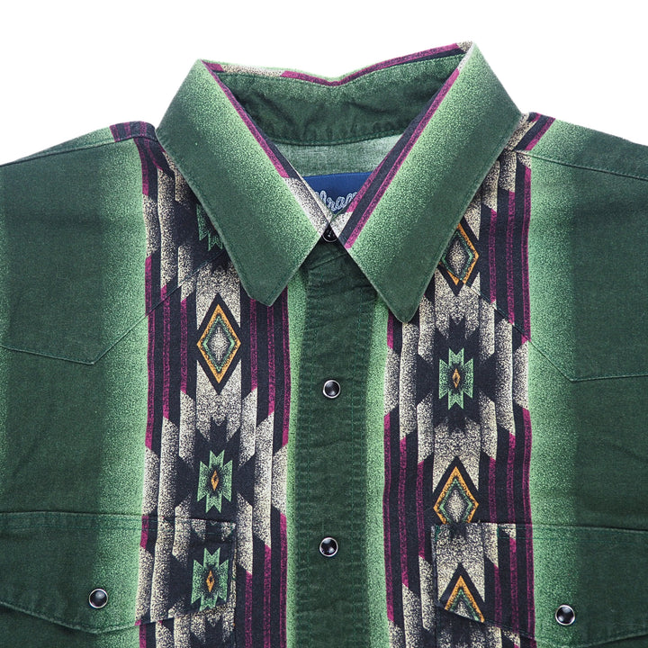 Close up of the chest and neck area of a western style shirt with geometric pattern.