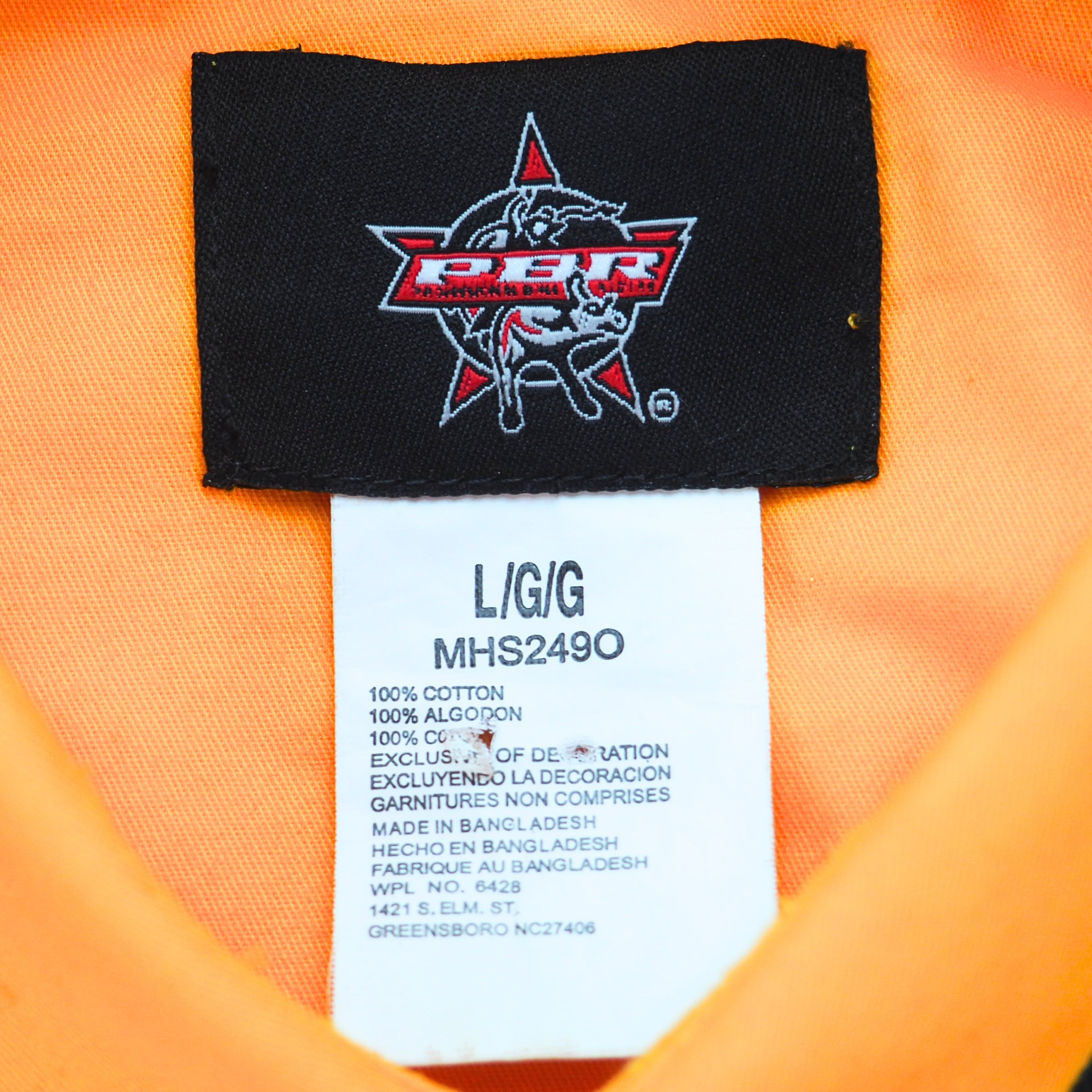 Close up of the care and brand label of a collared shirt