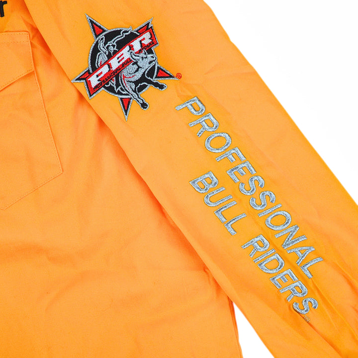 Detail of embroidery on a yellow shirt sleeve reading 'Professional Bull Riders'