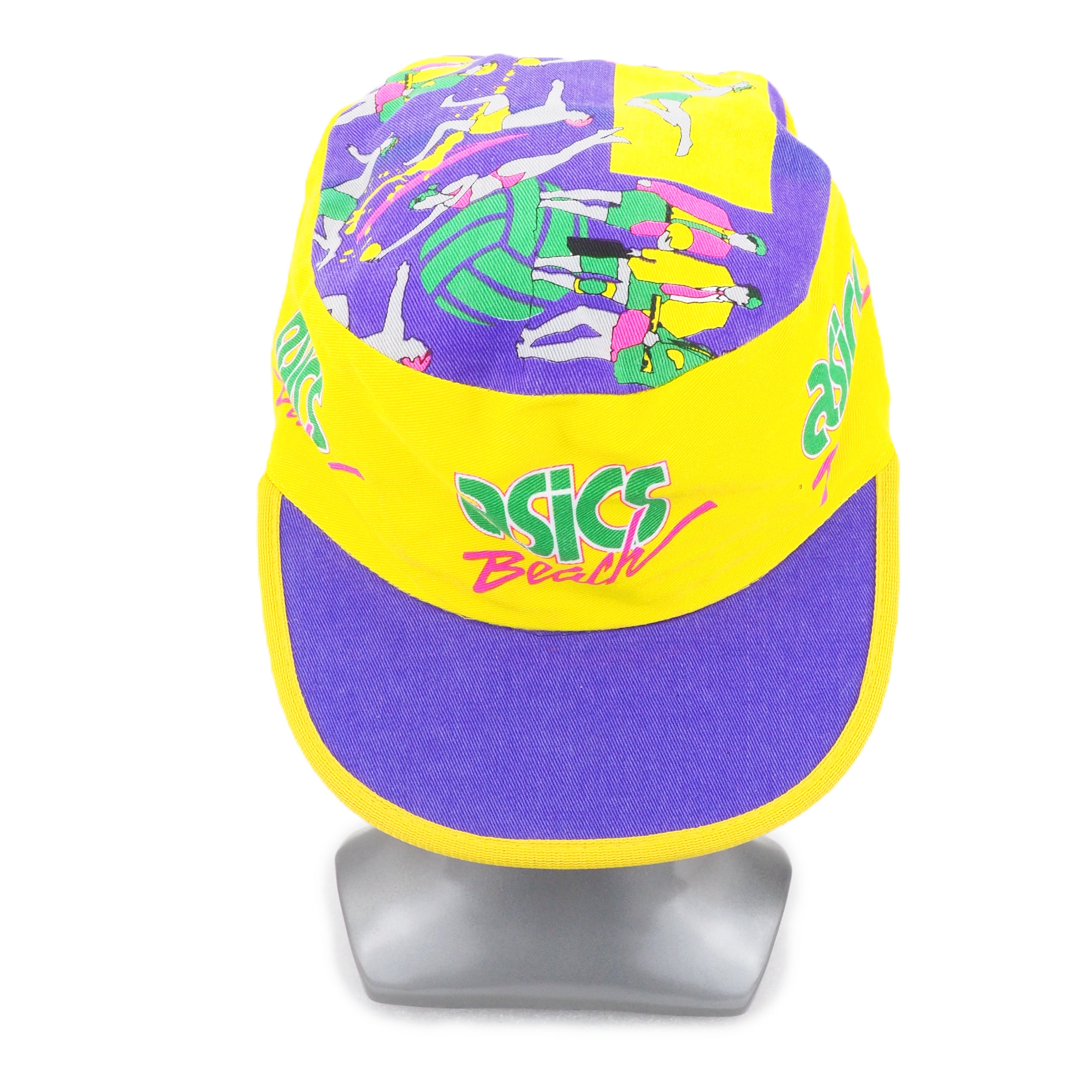 Colorful cap with 'Asics' branding on a stand against a white background