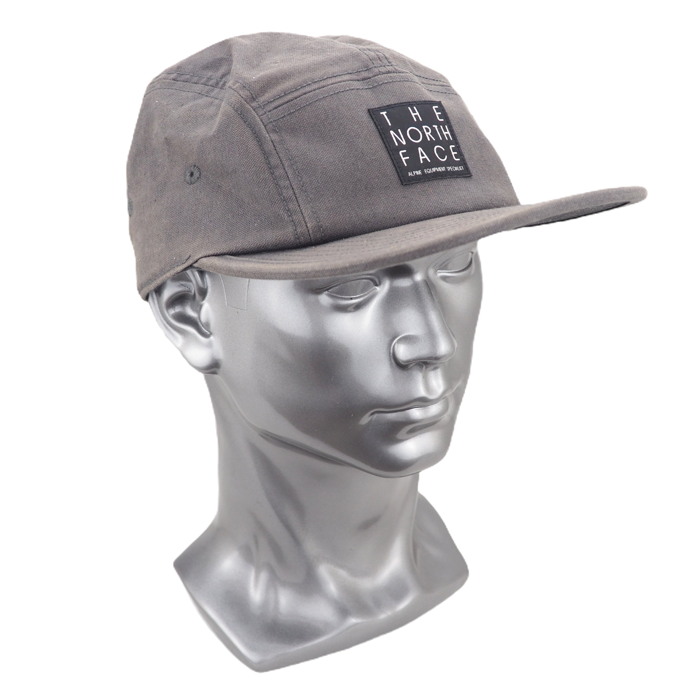 Gray cap with 'The North Face' logo on a mannequin head against a white background