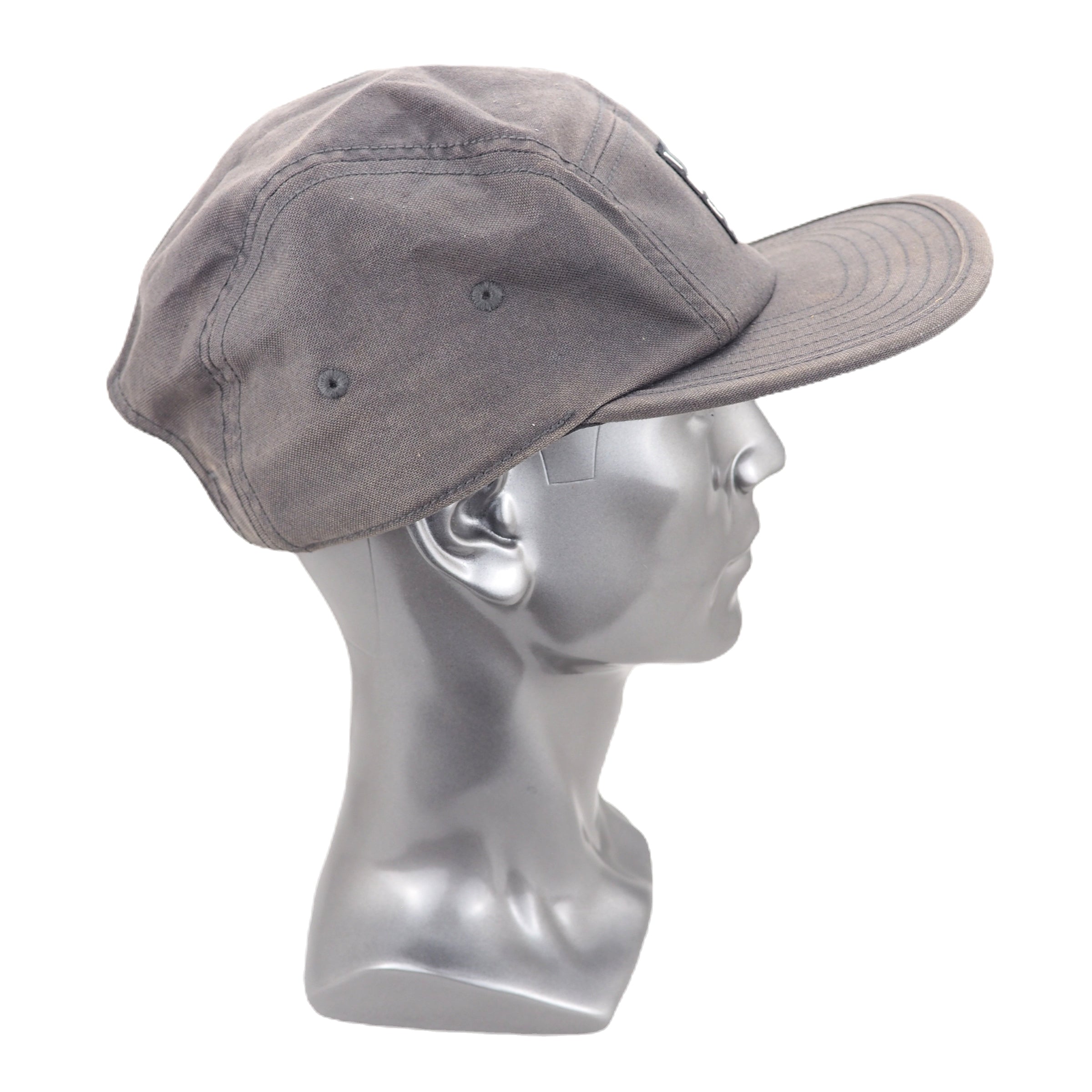 Gray cap on a mannequin head against a white background