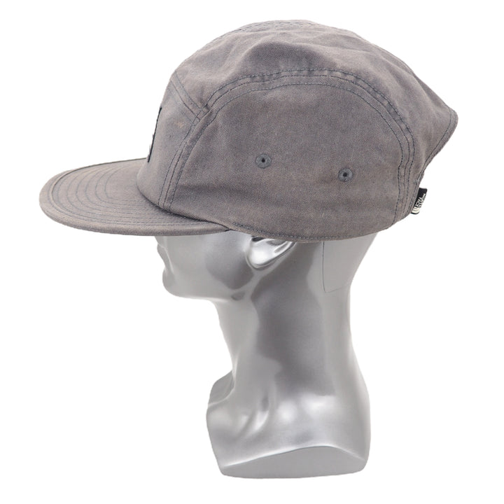 Gray cap on a mannequin head against a white background