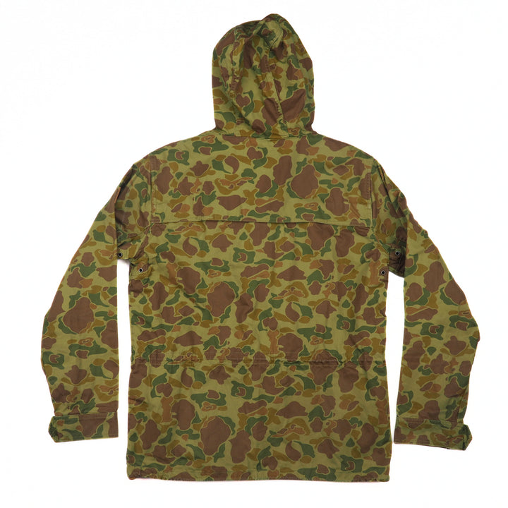 Back view of a green and brown camouflage-patterned jacket on a white background