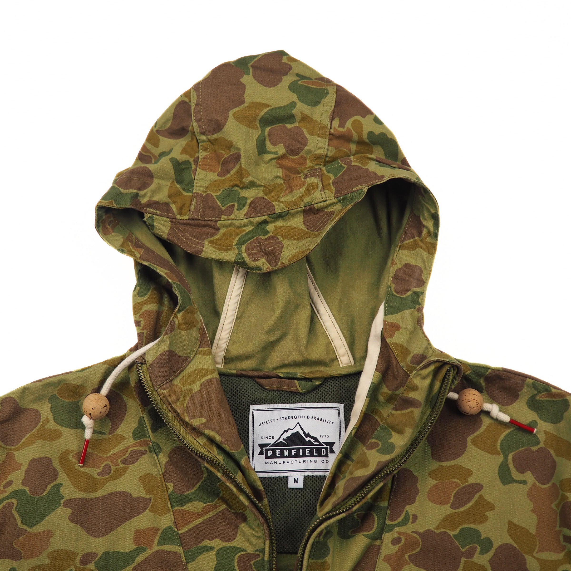 Camouflage hooded jacket with Penfield brand label on a white background