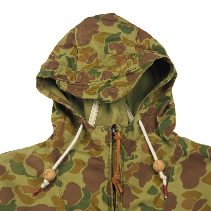 Camouflage hooded jacket with brown, green, and beige pattern on a white background