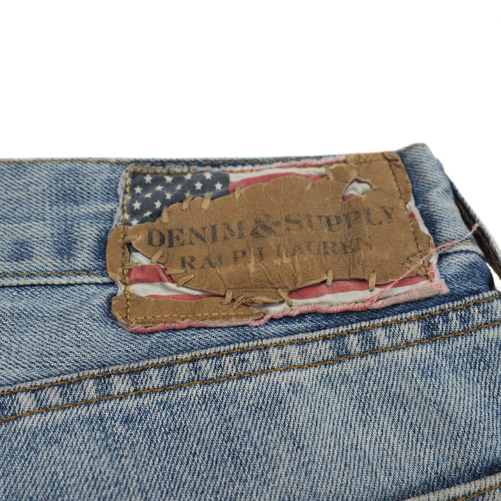Close-up of a denim label with 'Denim & Supply Ralph Lauren' on a white background