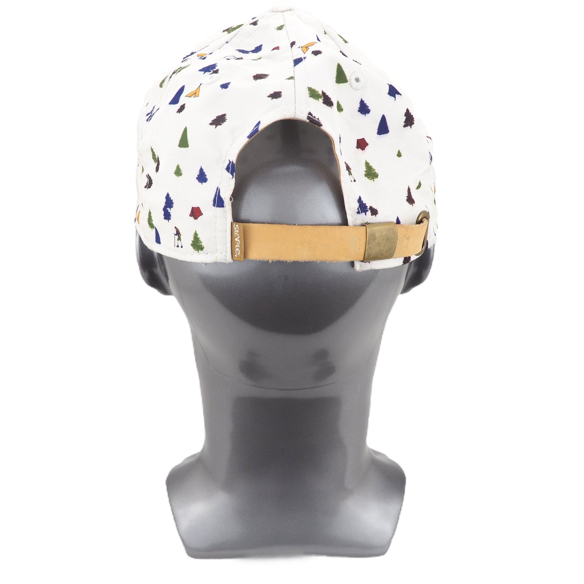 Colorful patterned cap on a gray mannequin head against a white background