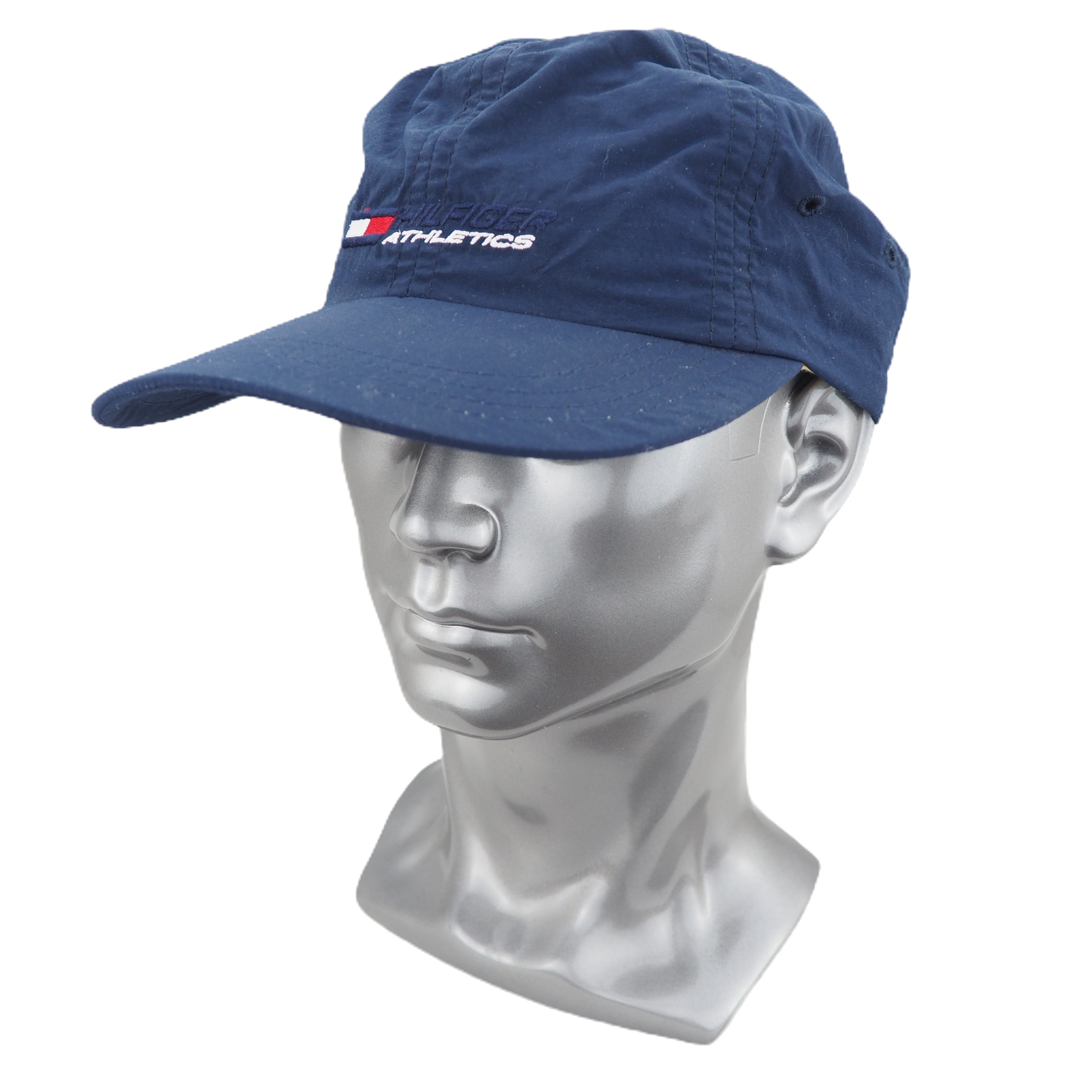 Blue cap on a silver mannequin head with 'Hilfiger Athletics' branding.