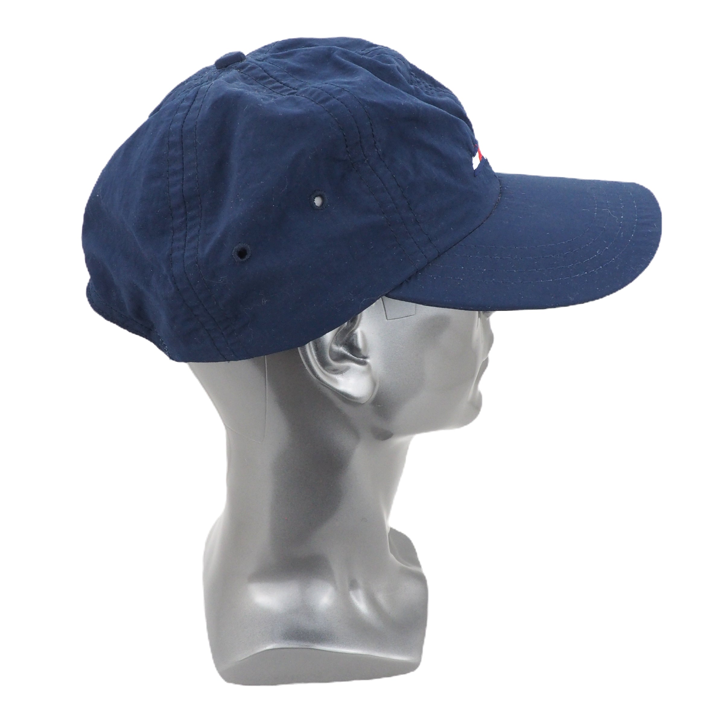 Blue cap on a mannequin head against a white background