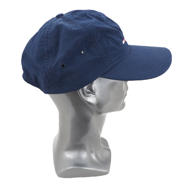 Blue cap on a mannequin head against a white background