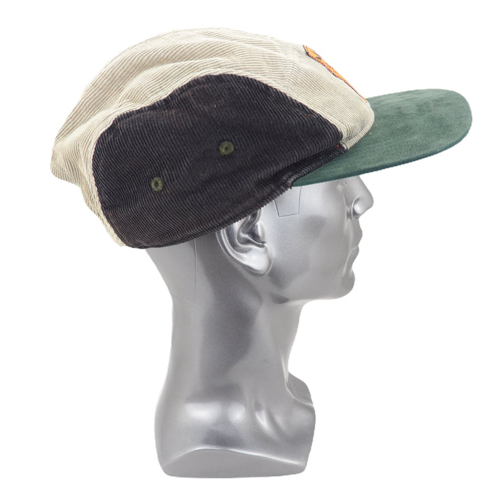 Three-tone corduroy cap on a mannequin head against a white background