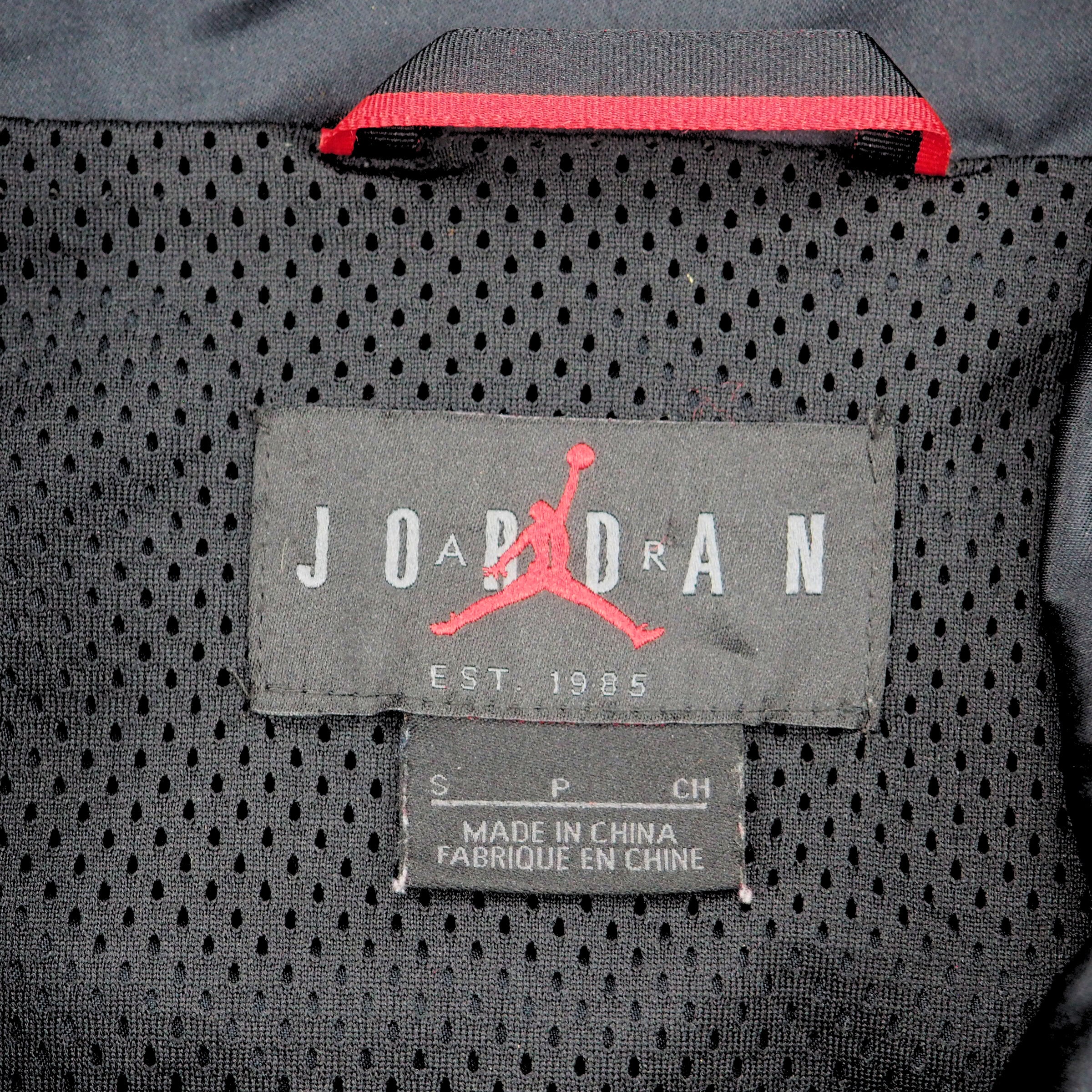 Close-up of a Air Jordan brand label on a textured mesh fabric surface