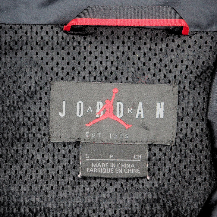Close-up of a Air Jordan brand label on a textured mesh fabric surface