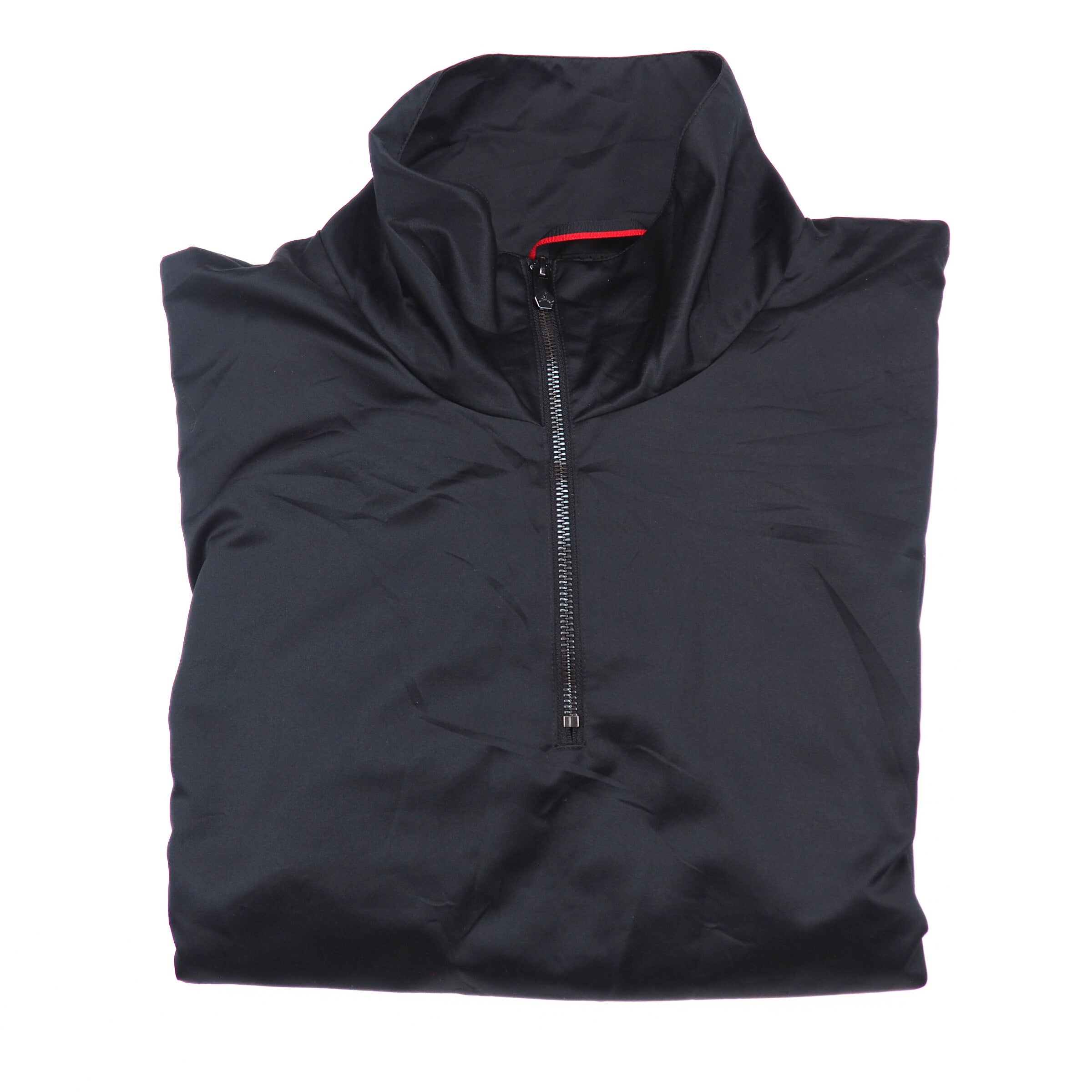 Folded black jacket with a zipper on a white background