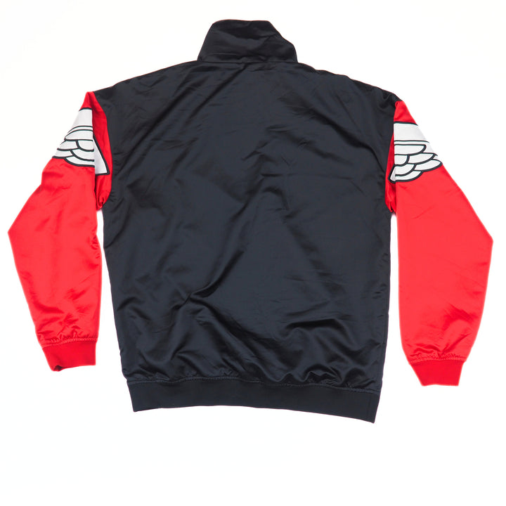 Black jacket with red sleeves and white wing designs on a white background