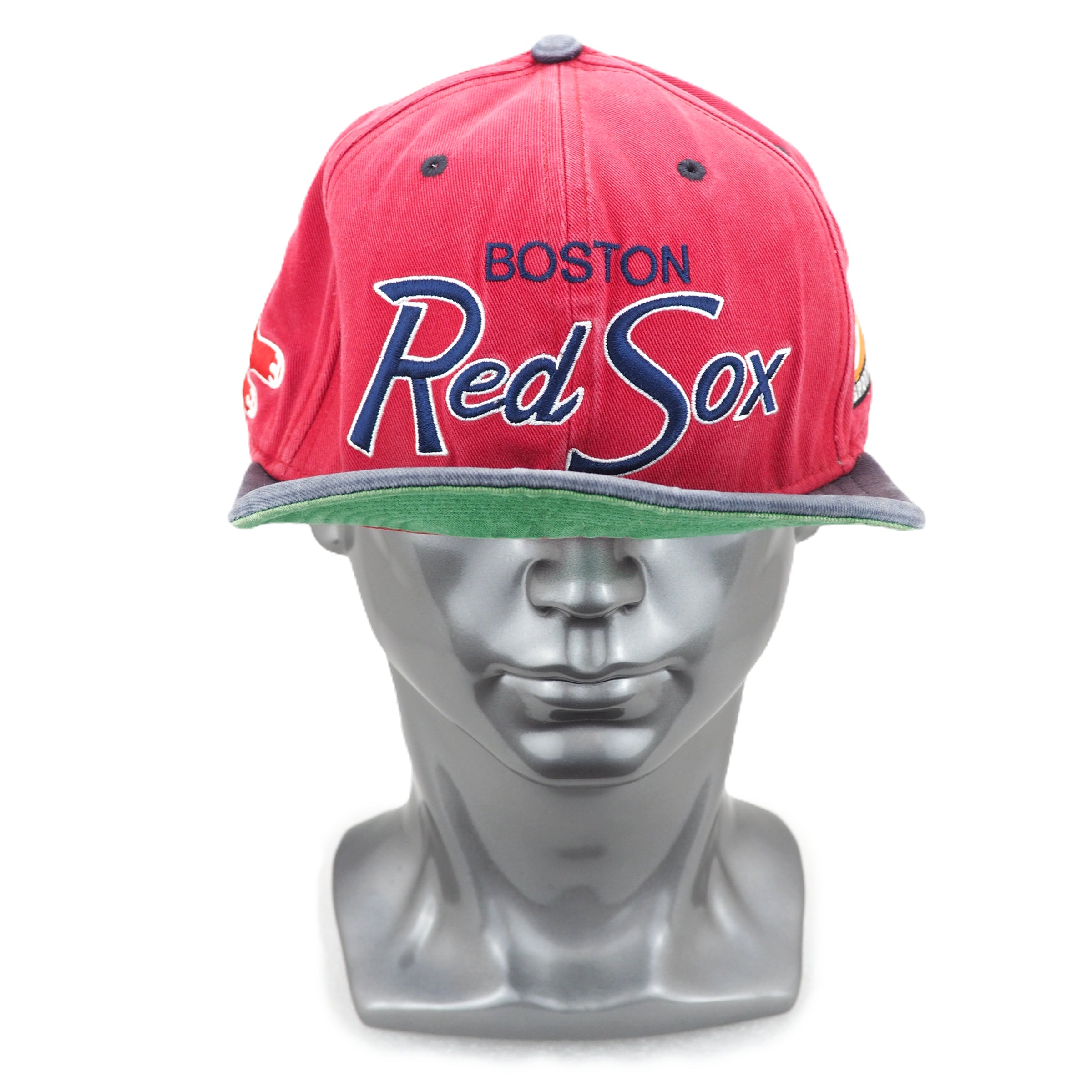 Red Sox cap on a mannequin head with a white background