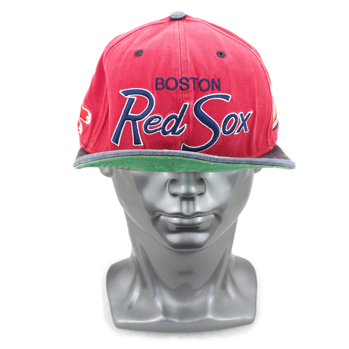 Red Sox cap on a mannequin head with a white background