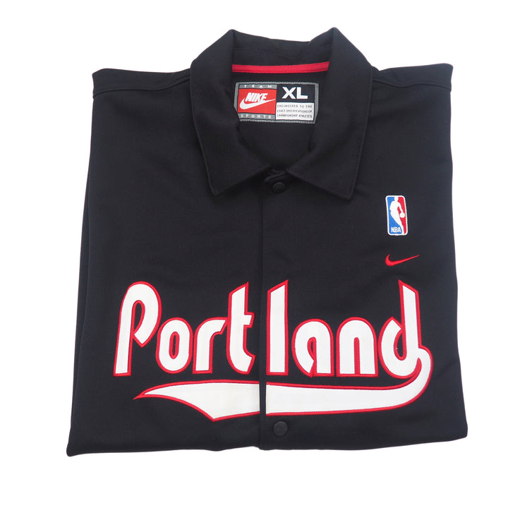 Black Portland jersey with Nike Team Sports label and NBA logo on a white background